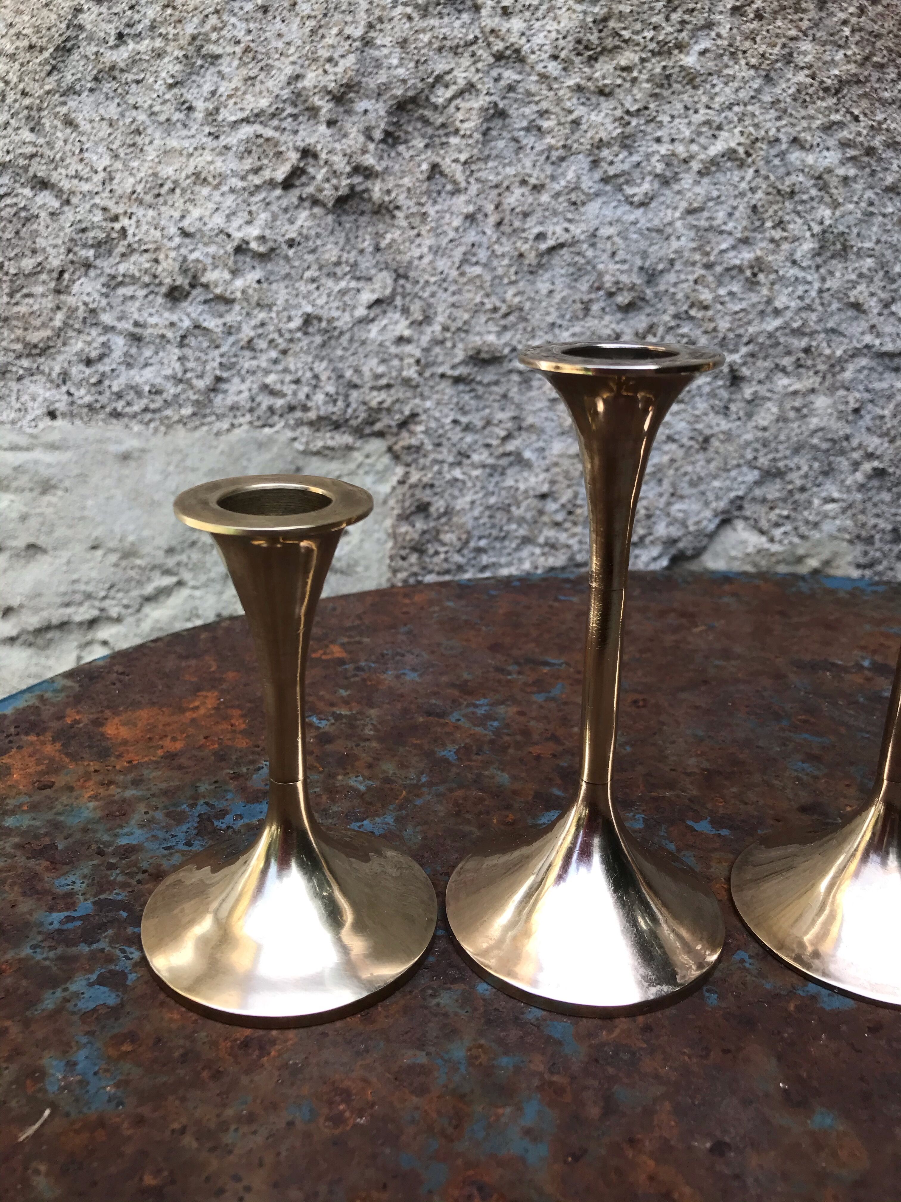 Series of 5 brass candlesticks