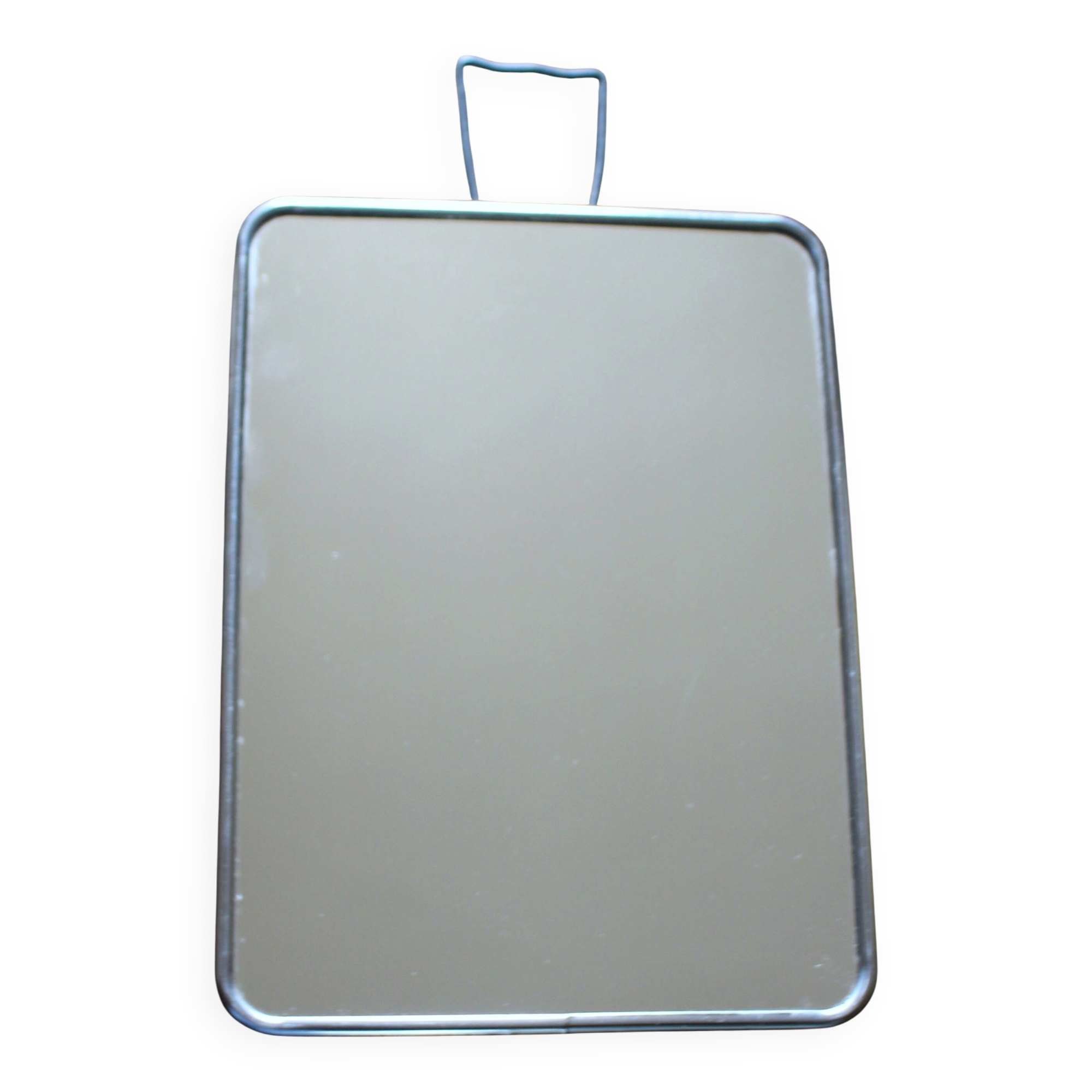 Simple rectangular barber mirror with a stand.