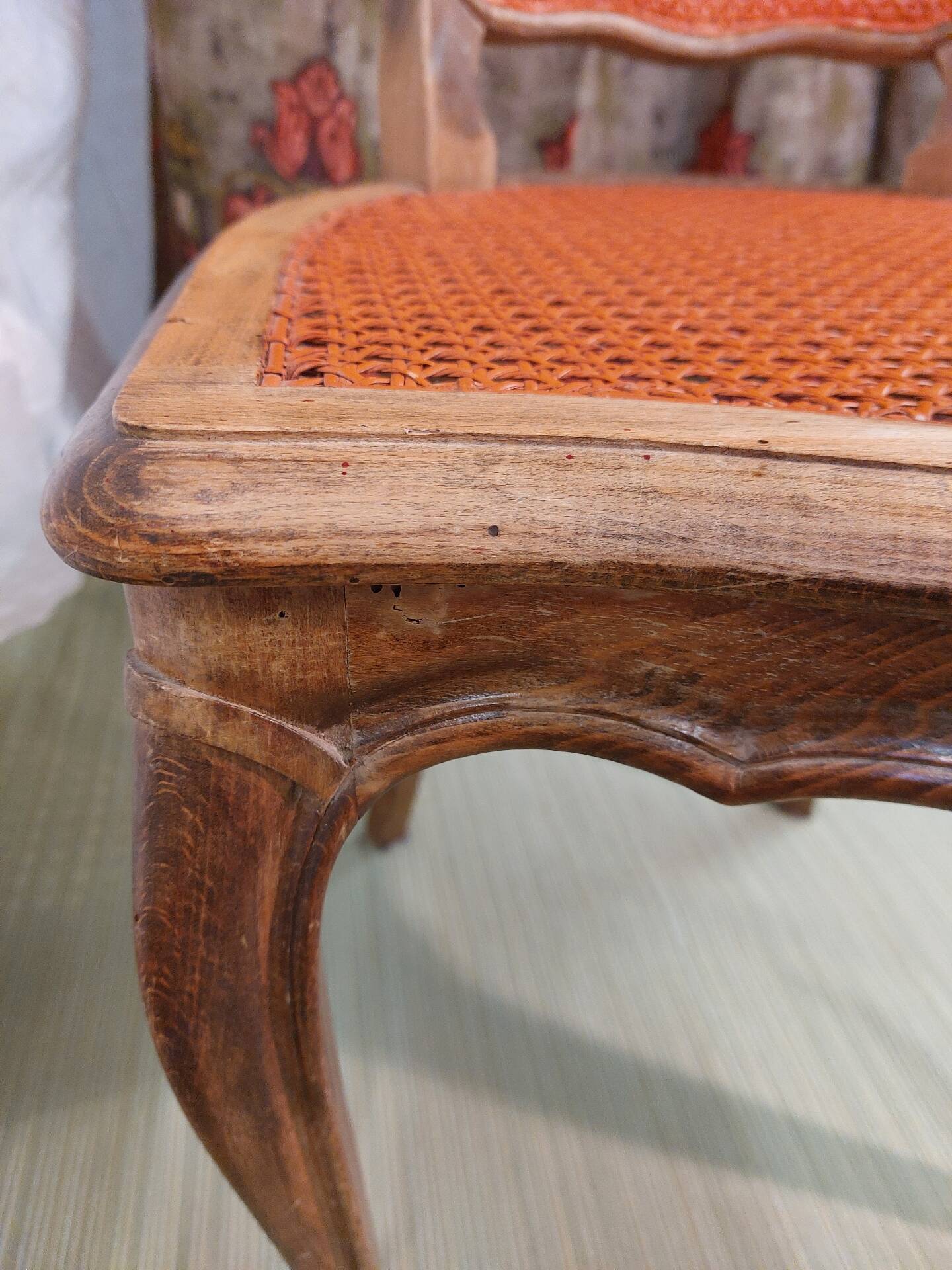 Caned chair in Louis XV style painted orange.
