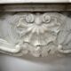 Louis XV style fireplace in veined white marble, 20th century.