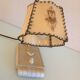 Brass bedside lamp and beige lampshade art deco style