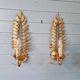 Pair of gold metal wall sconces in Hollywood Regency style, 1970s.