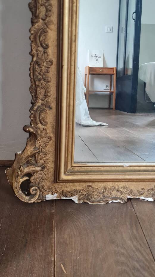 Antique Louis Philippe mirror with a pediment.