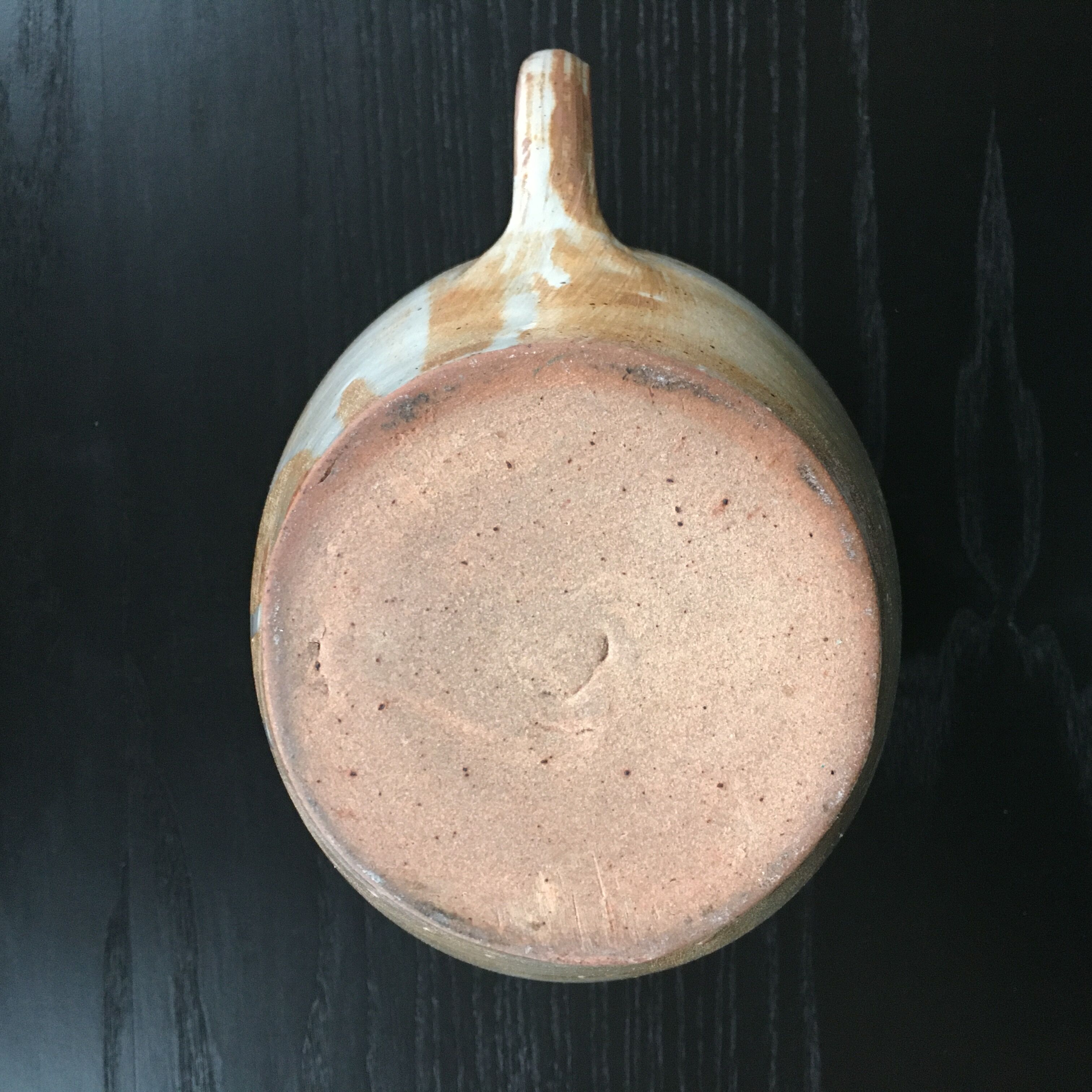 Beige stoneware pitcher with white drips