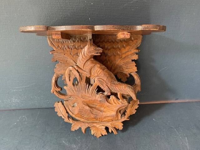 Black Forest carved wooden wall console, harness with wolf decoration