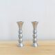 Pair of vintage cast aluminum candle holders