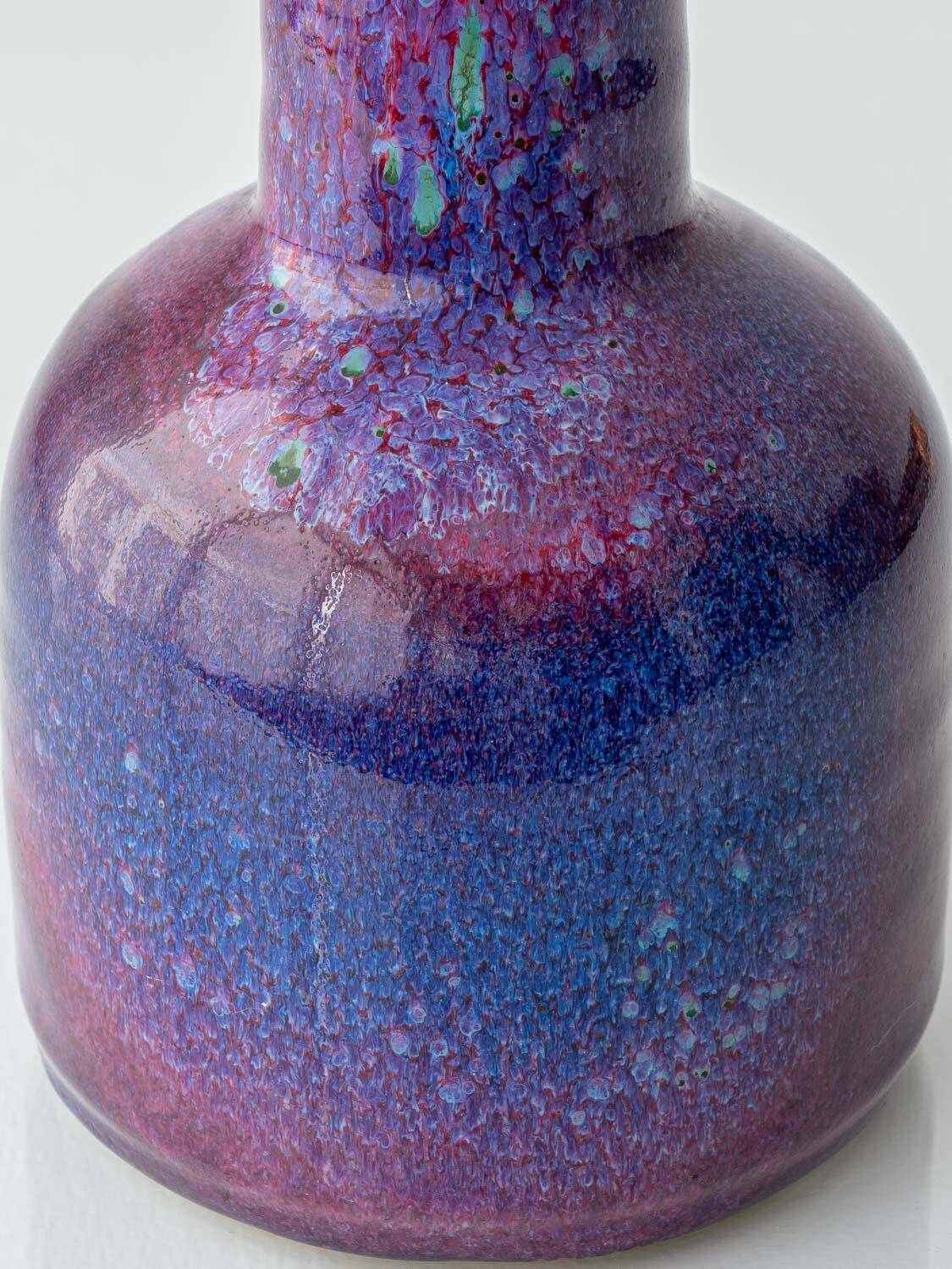 Mid-century modern table lamp by Jaap Ravelli, ceramic base and glass shade.