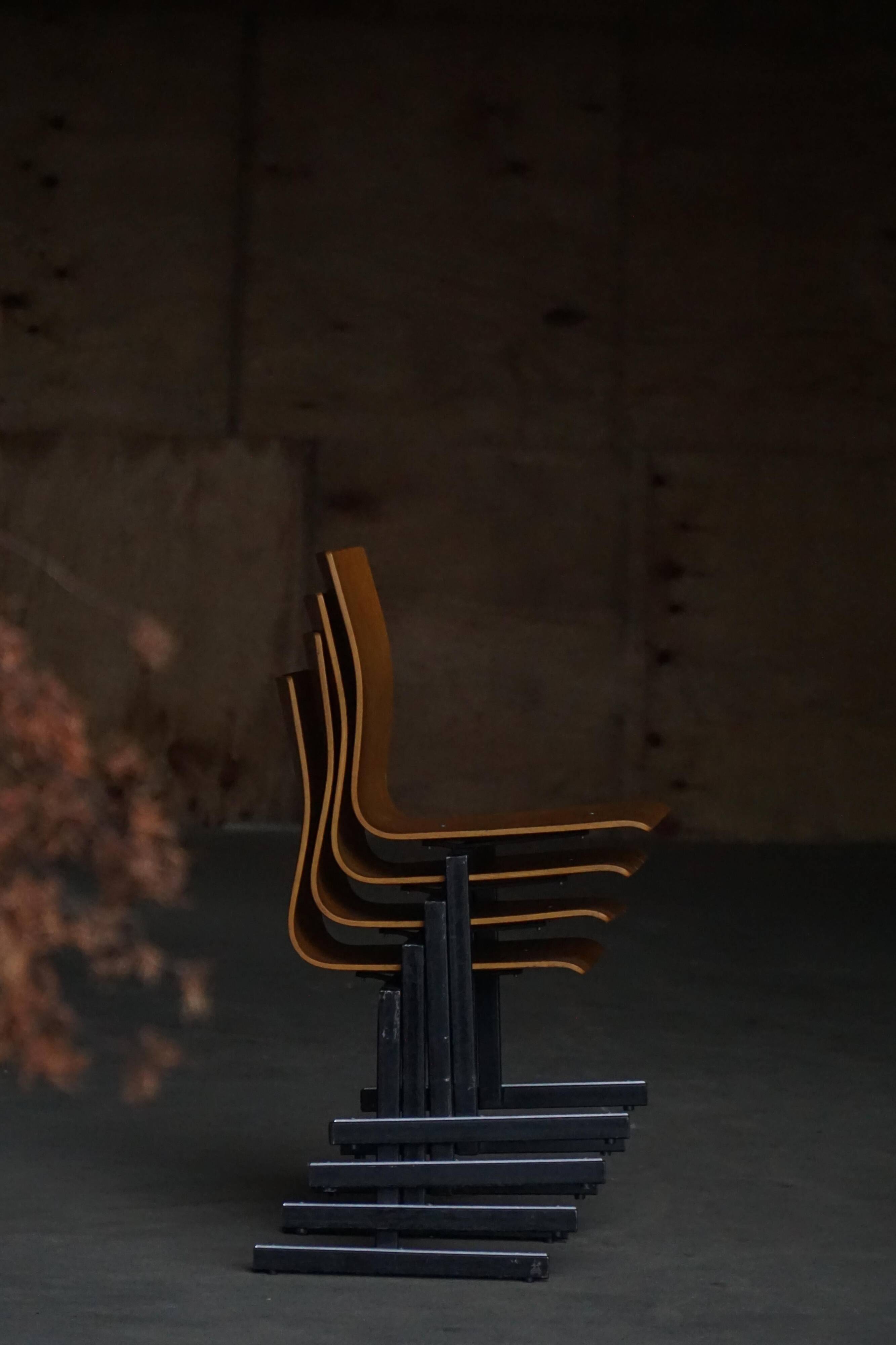 Set of 6 industrial stackable chairs by Niels Larsen, black metal and oak, 1960s.