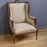 Wingback armchair in walnut, Louis XVI style – late 19th century