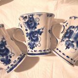 Three cups and two saucers made of Gzhel porcelain.