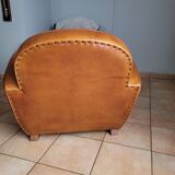 Leather club armchair and its pouf