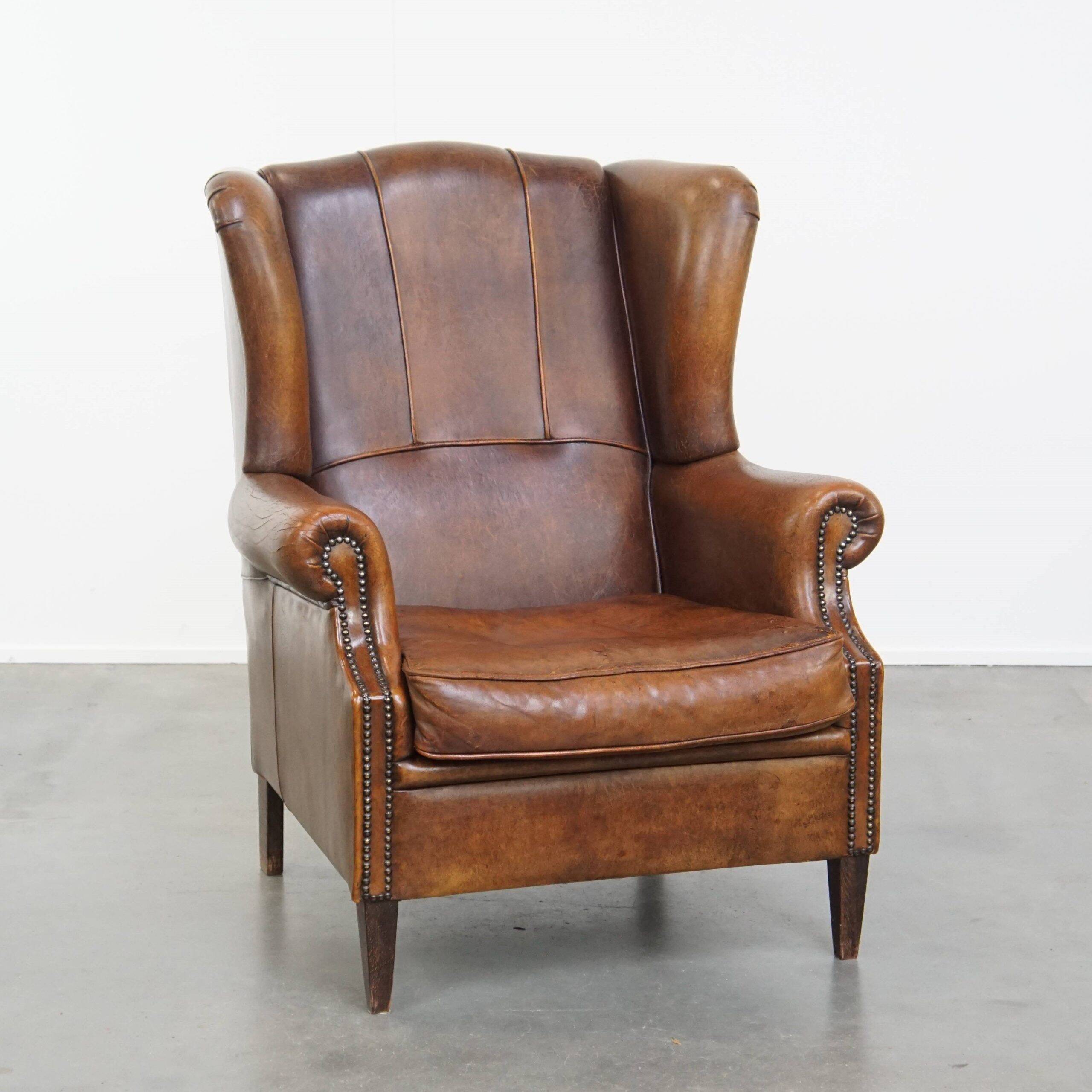 Sheepskin wingback chair in good condition