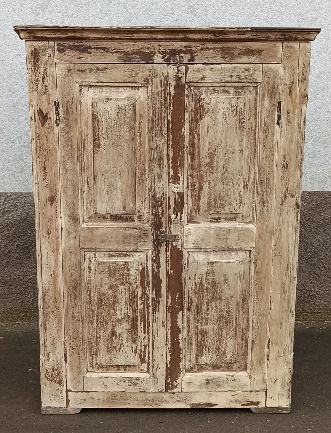 Old wooden wardrobe beige / pale yellow façade