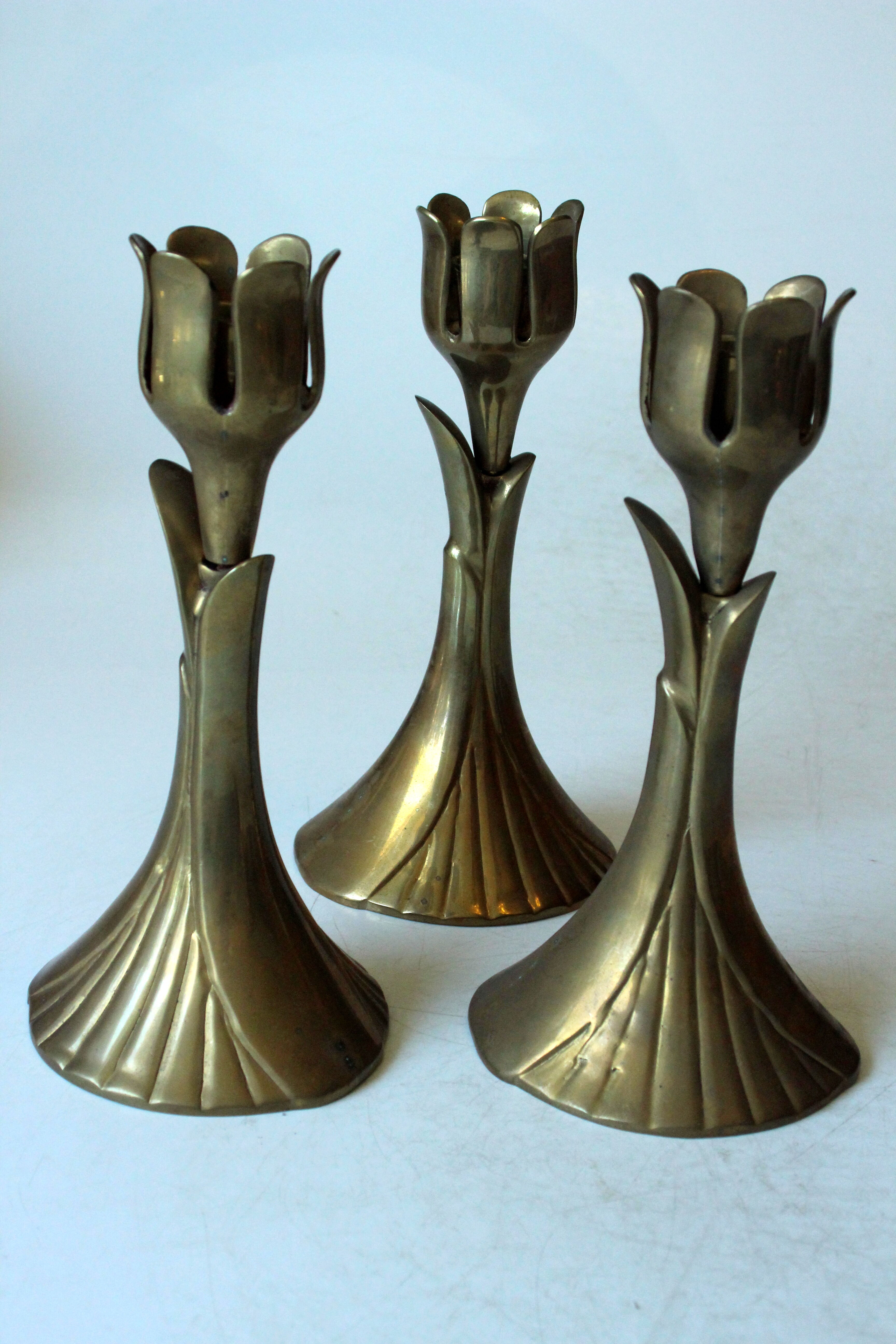 3 beautifull solid brass candle holders with floral motif, vintage from the 1960s