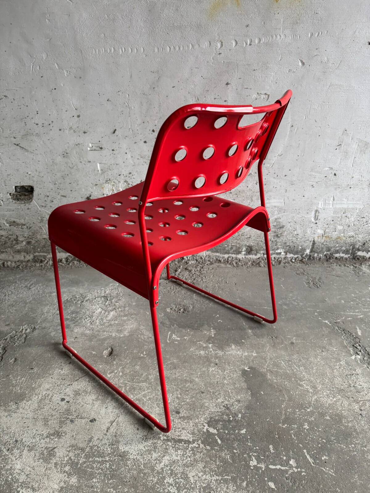 Red powder-coated steel Omstak chair by Rodney Kinsman for Bieffeplast — 1980 industrial design