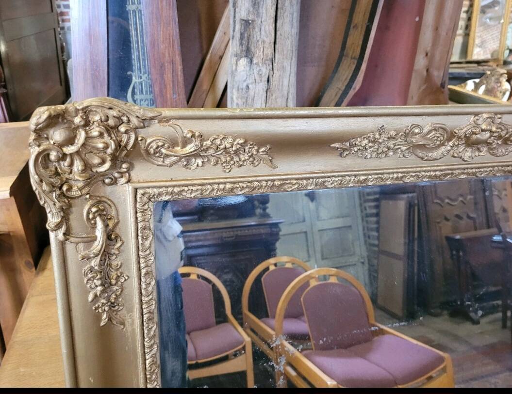 Antique gilded mirror from the 19th century, mercury mirror.
