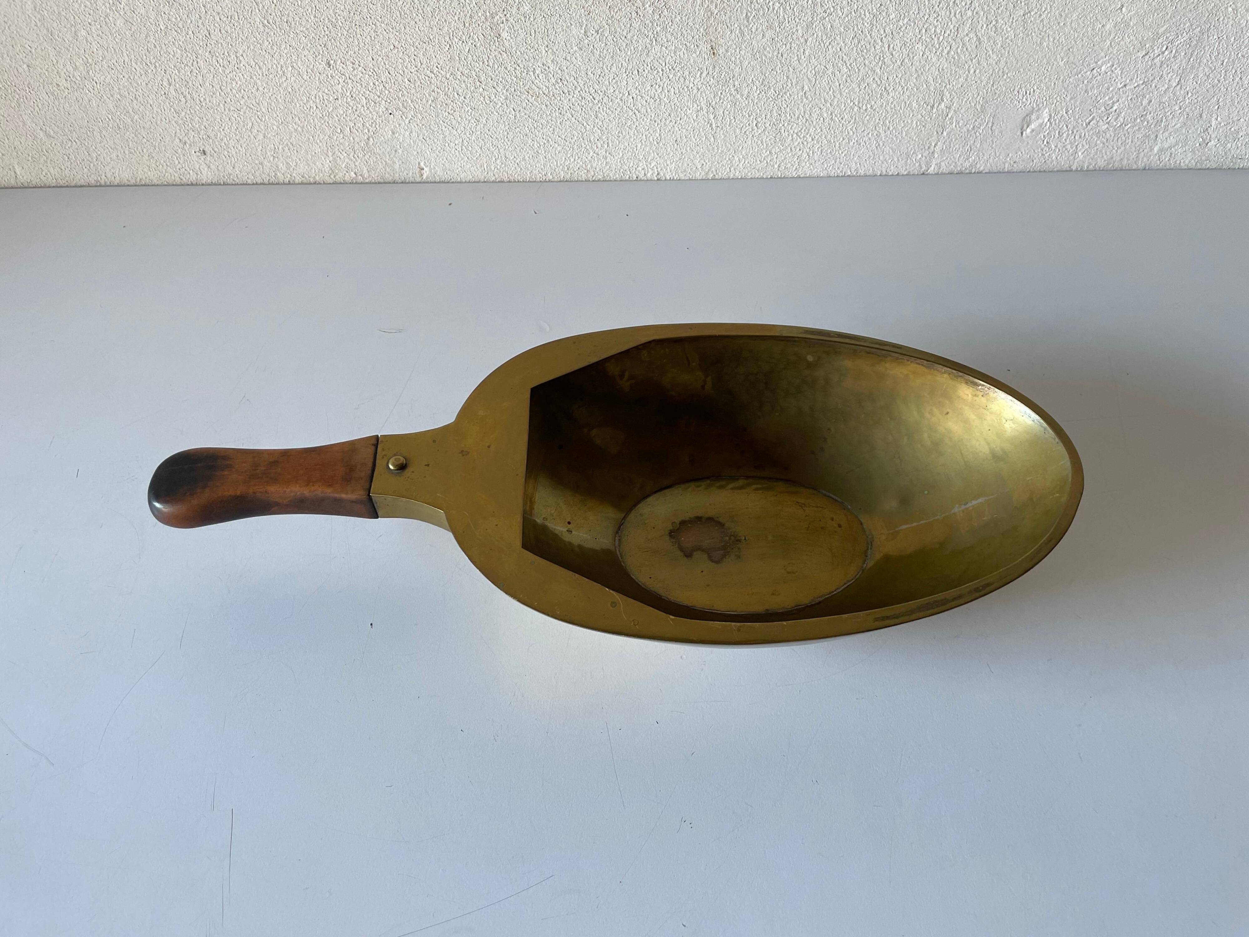 Decorative brass bowl with wooden handle, 1970s, Turin, Italy.