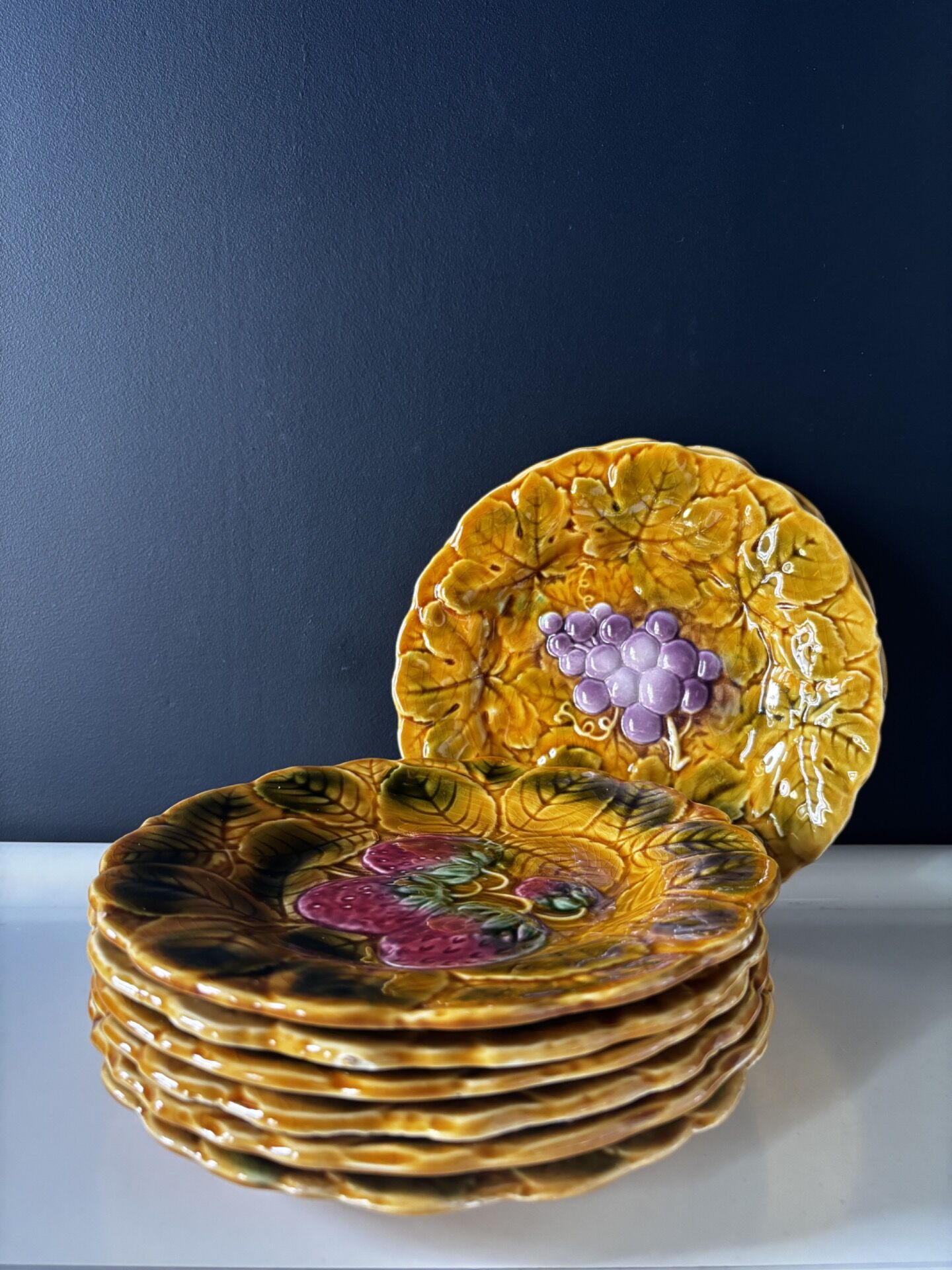 Set of 8 Sarreguemines barbotine plates — relief fruit decoration