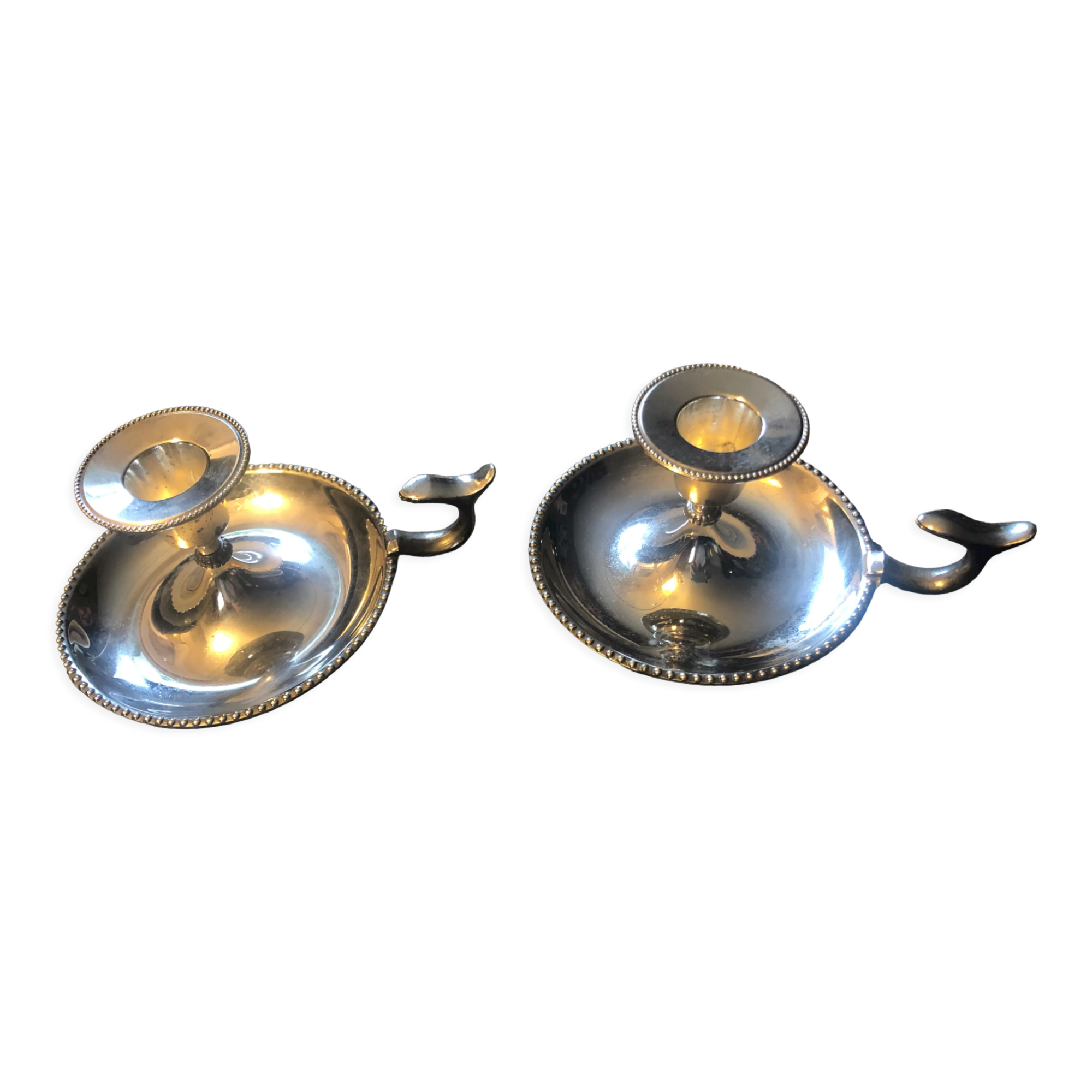 Pair of silver metal hand candle holders