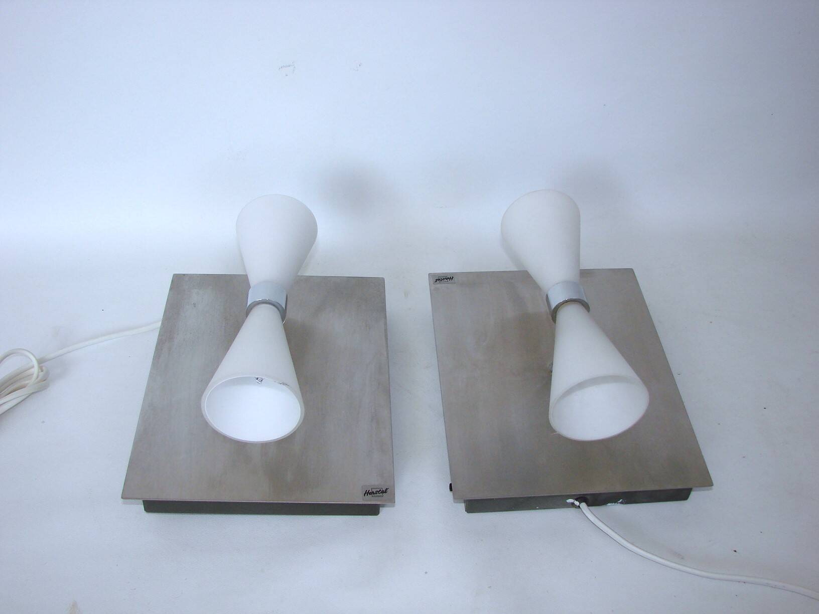 A pair of modern herstal wall lamps from the 2000s - stylish lighting for m