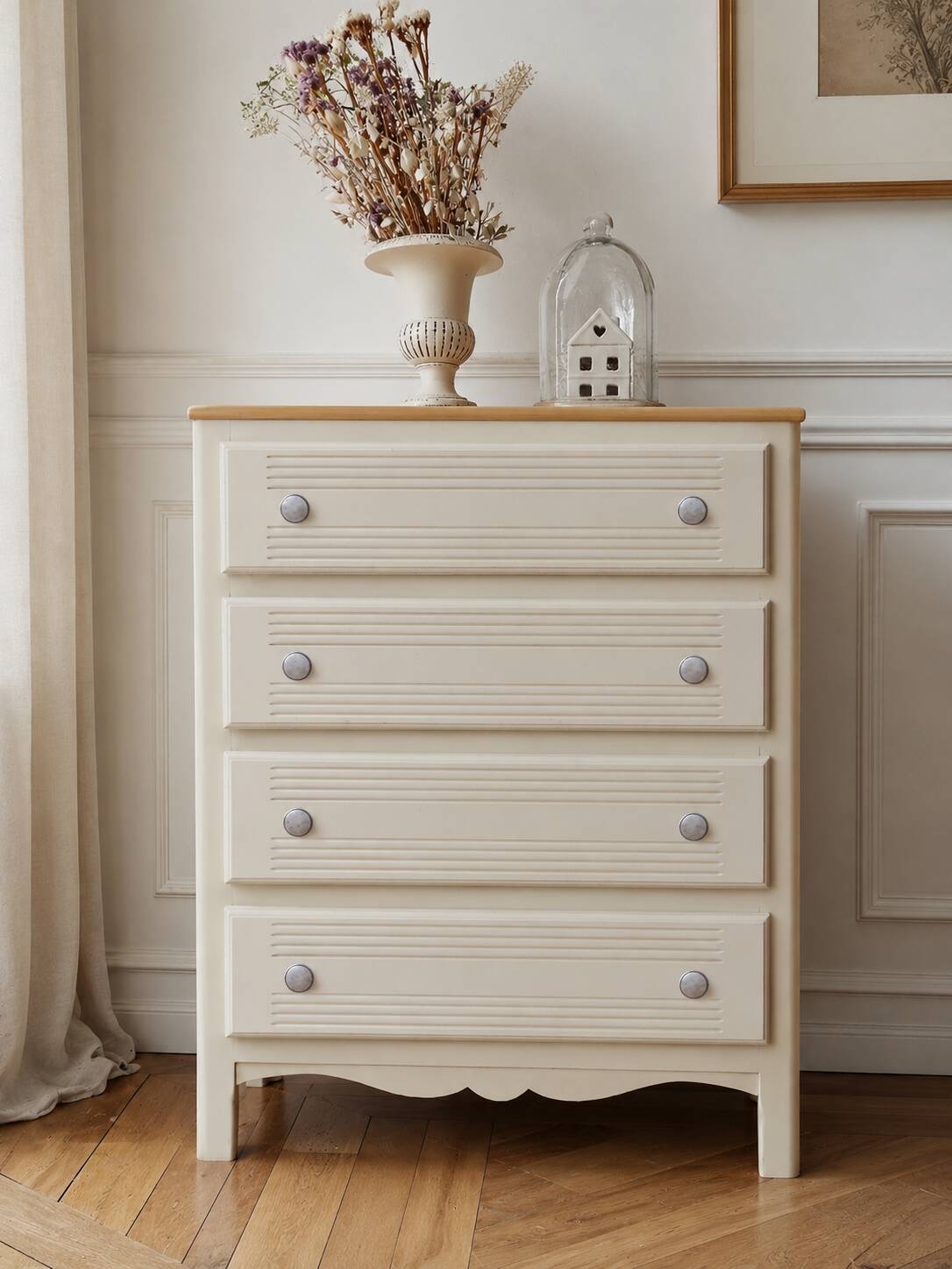 Vintage commode enhanced in beige, wooden top.