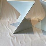 Pair of unmarked triangular white design stools
