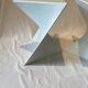 Pair of unmarked triangular white design stools