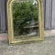 Louis Philippe mirror in gilded wood with an openwork frieze.