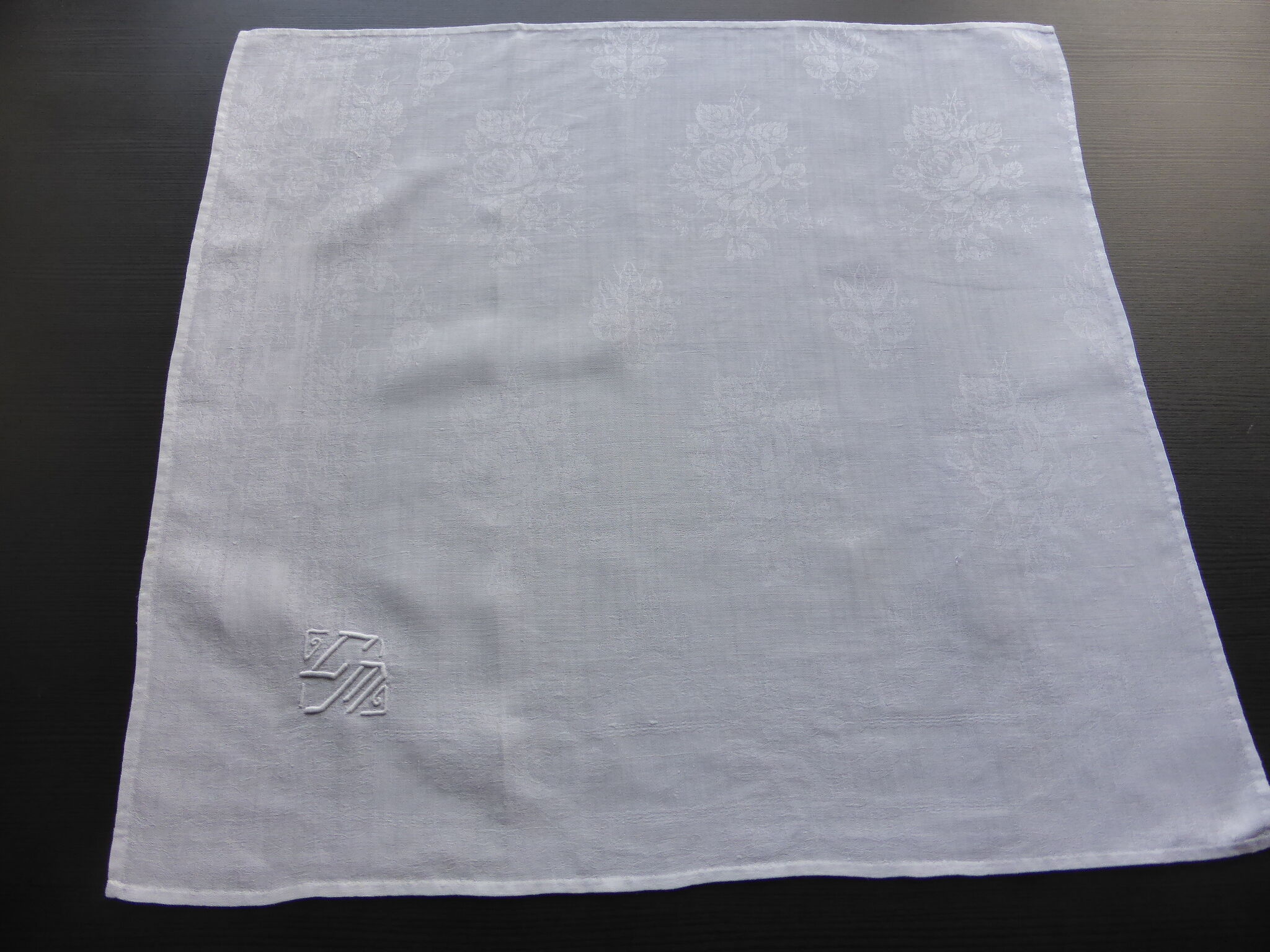 12 antique damask towels decorated with roses and embroidered with CM monogram
