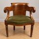 Empire-Charles X walnut office chair with a gondola backrest.