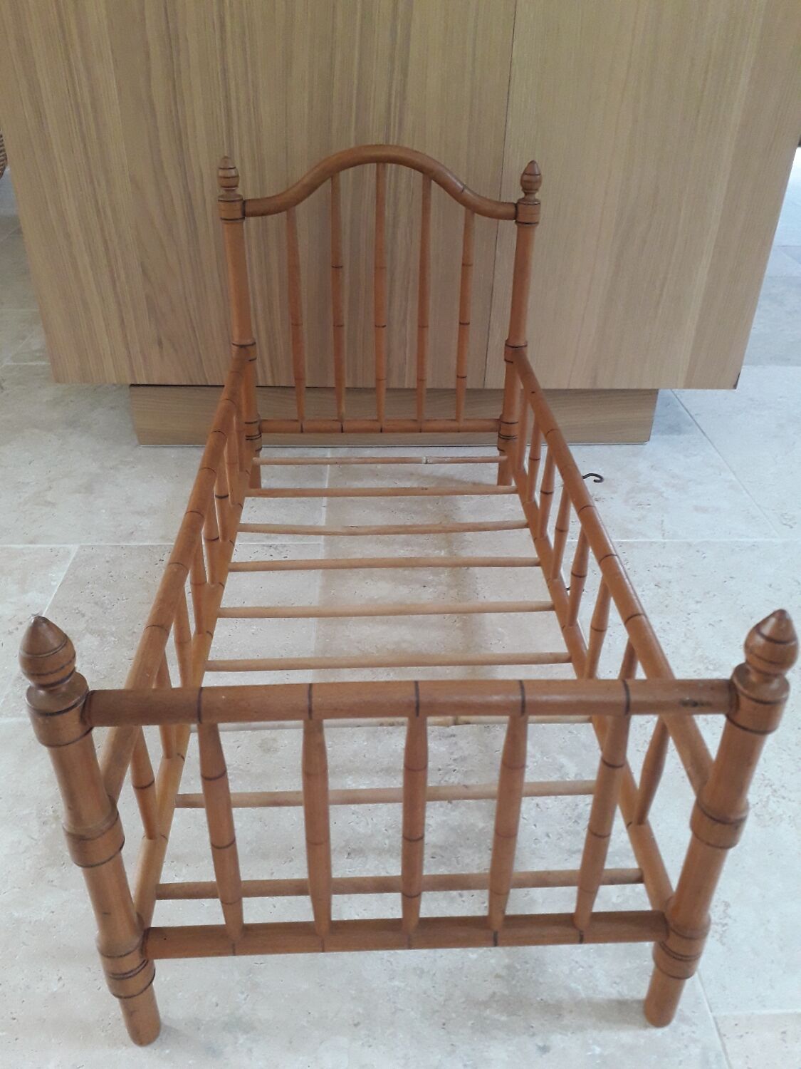 Old wooden doll's bed