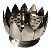 Picture of a lotus flower with a silver metal candlestick.