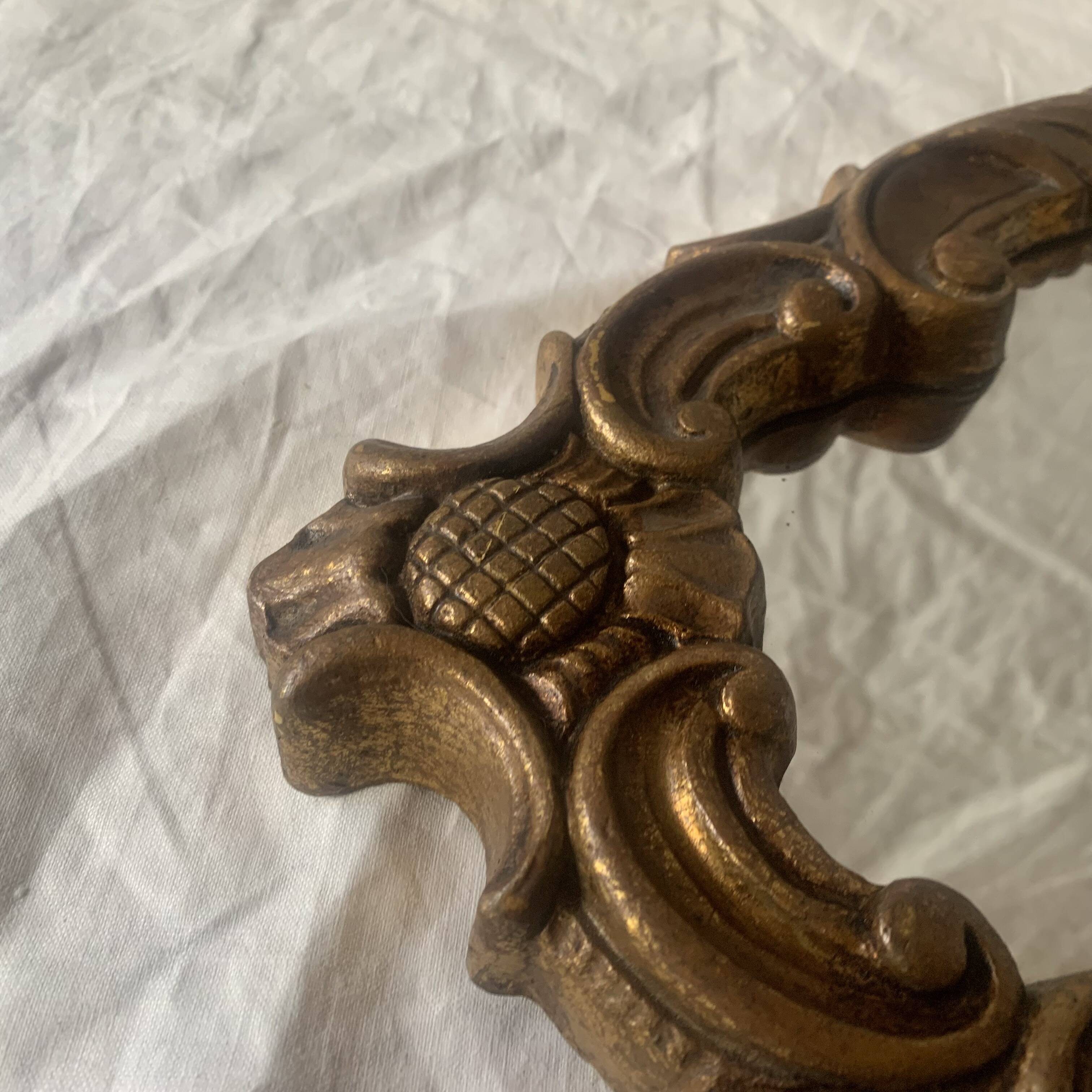 Vintage wall mirror in gold resin