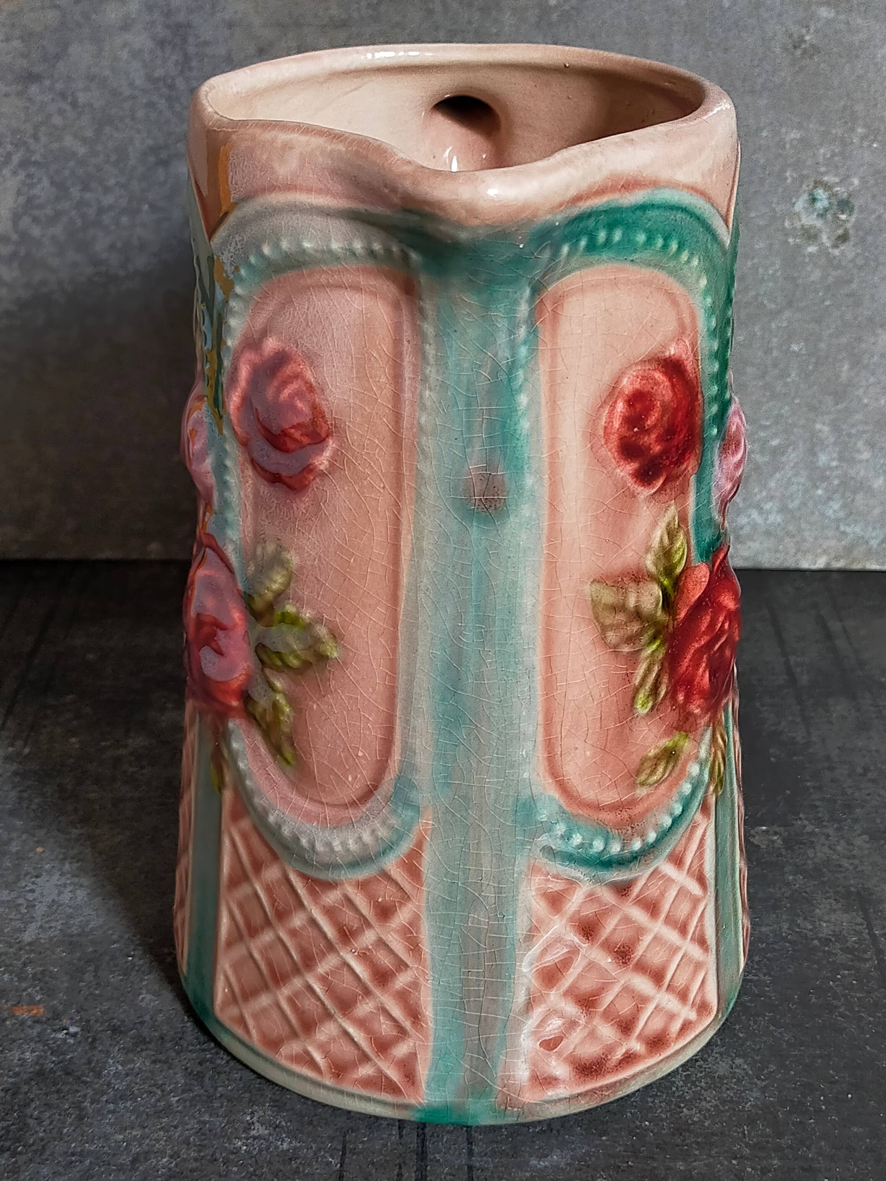 Antique slip pitcher with blooming roses