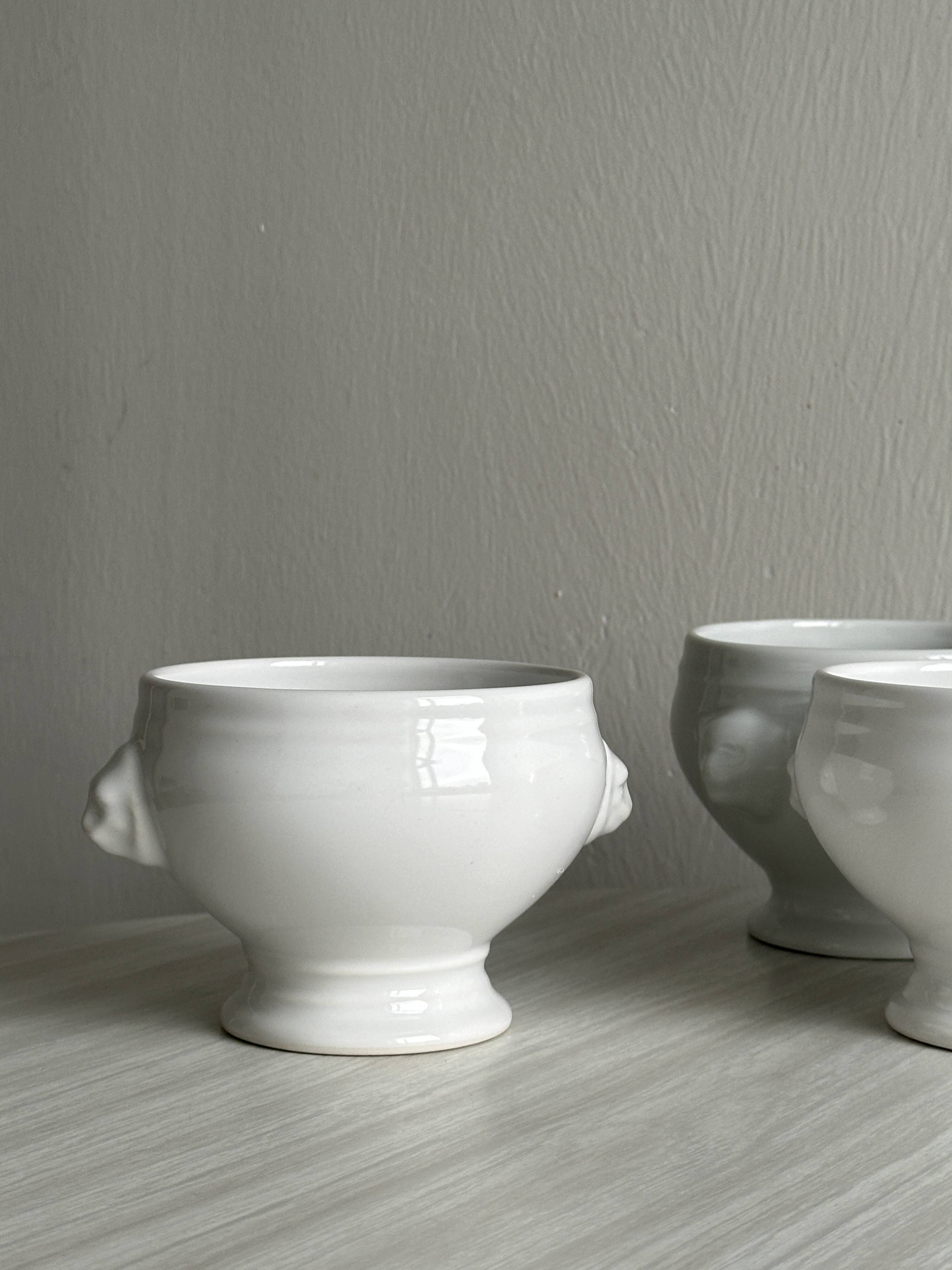 4 white porcelain bowls
