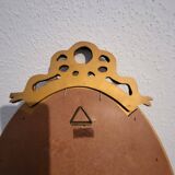 Miroir ovale à noeud doré  en bois