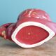 Poet Laval swan hides zoomorphic pot in burgundy ceramic.