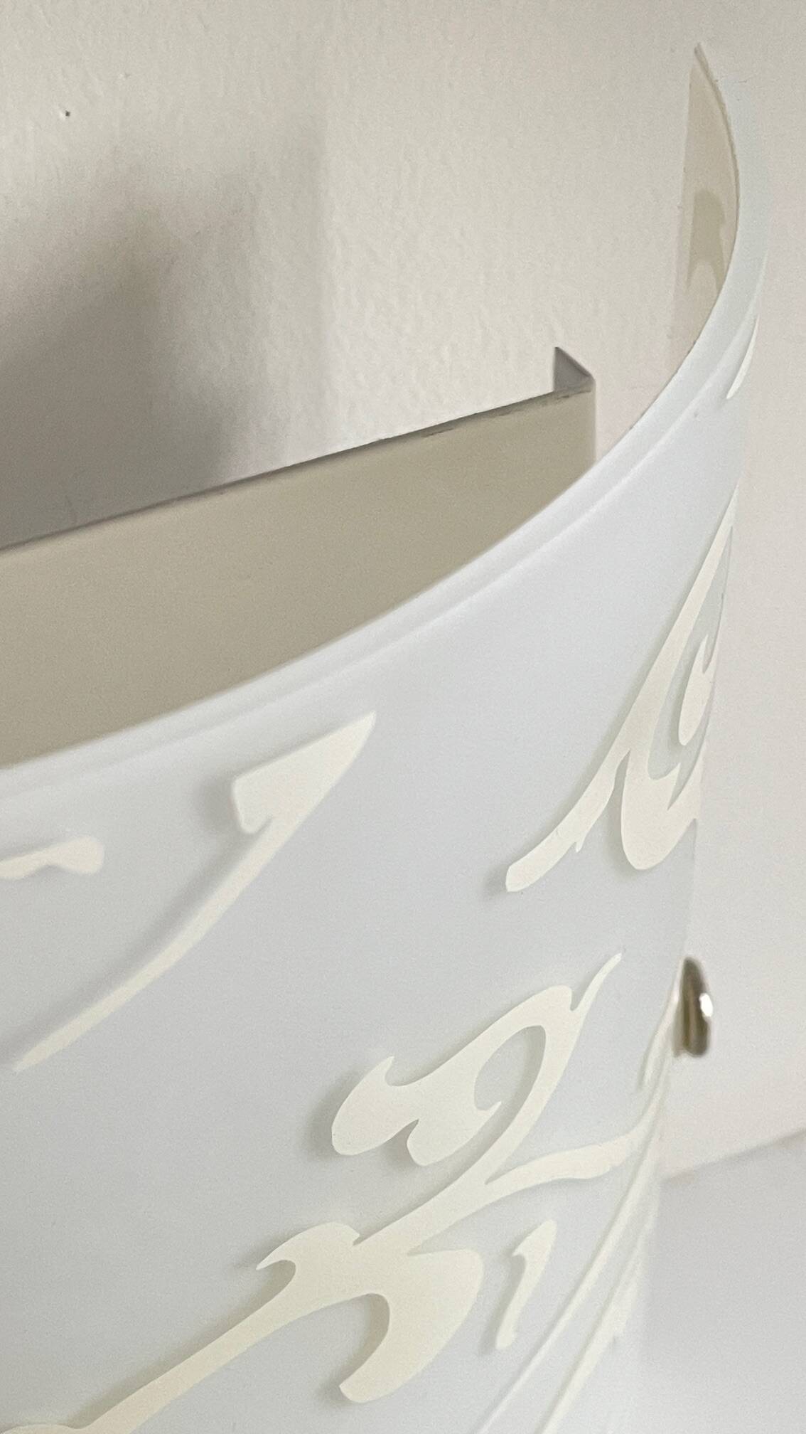 Polished and screen-printed glass sconce by eglo