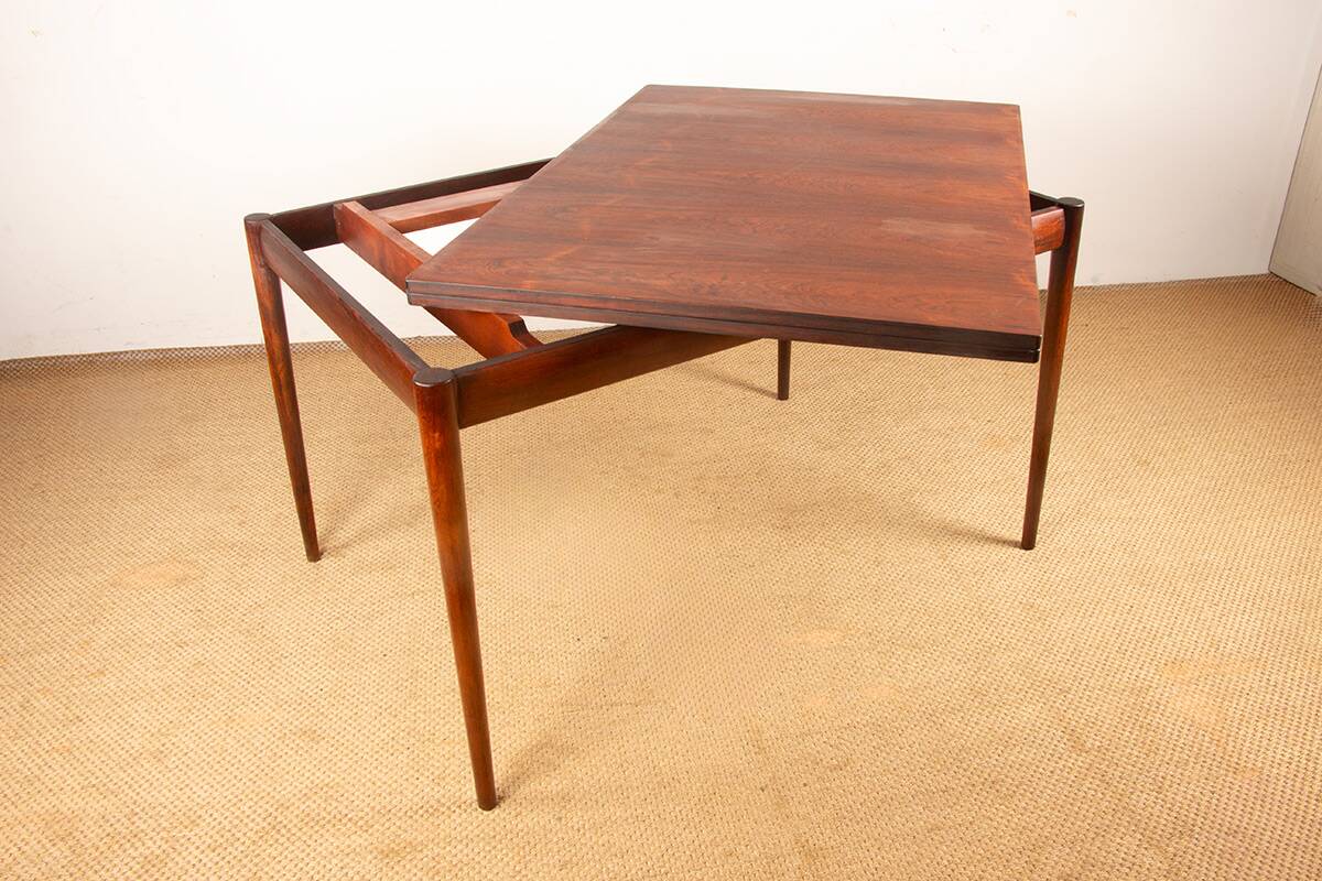 Danish extendable dining table in rosewood and brass by Poul Volther