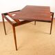 Danish extendable dining table in rosewood and brass by Poul Volther