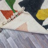 Handmade traditional Moroccan rug with colourful patterns, size 140x260 cm.