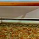 Rectangular wooden table, legs and spacer in hammered ironwork, 60s
