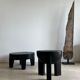 Black mango wood tripod side table with a semi-spherical top, height: 45 cm, diameter: 44 cm.