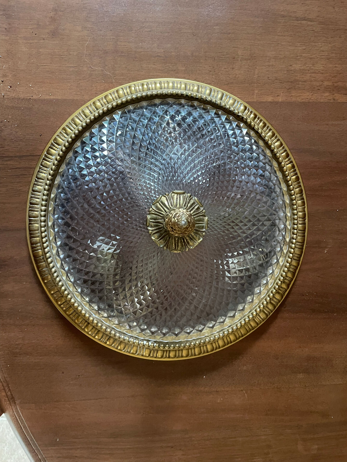 Antique ceiling light in bronze and cut crystal with diamond points.