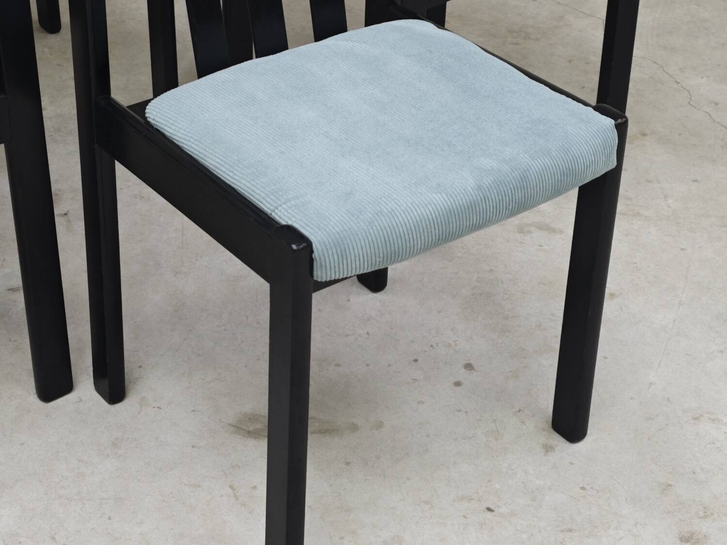 Set of 4 modernist black chairs with light blue ribbed fabric