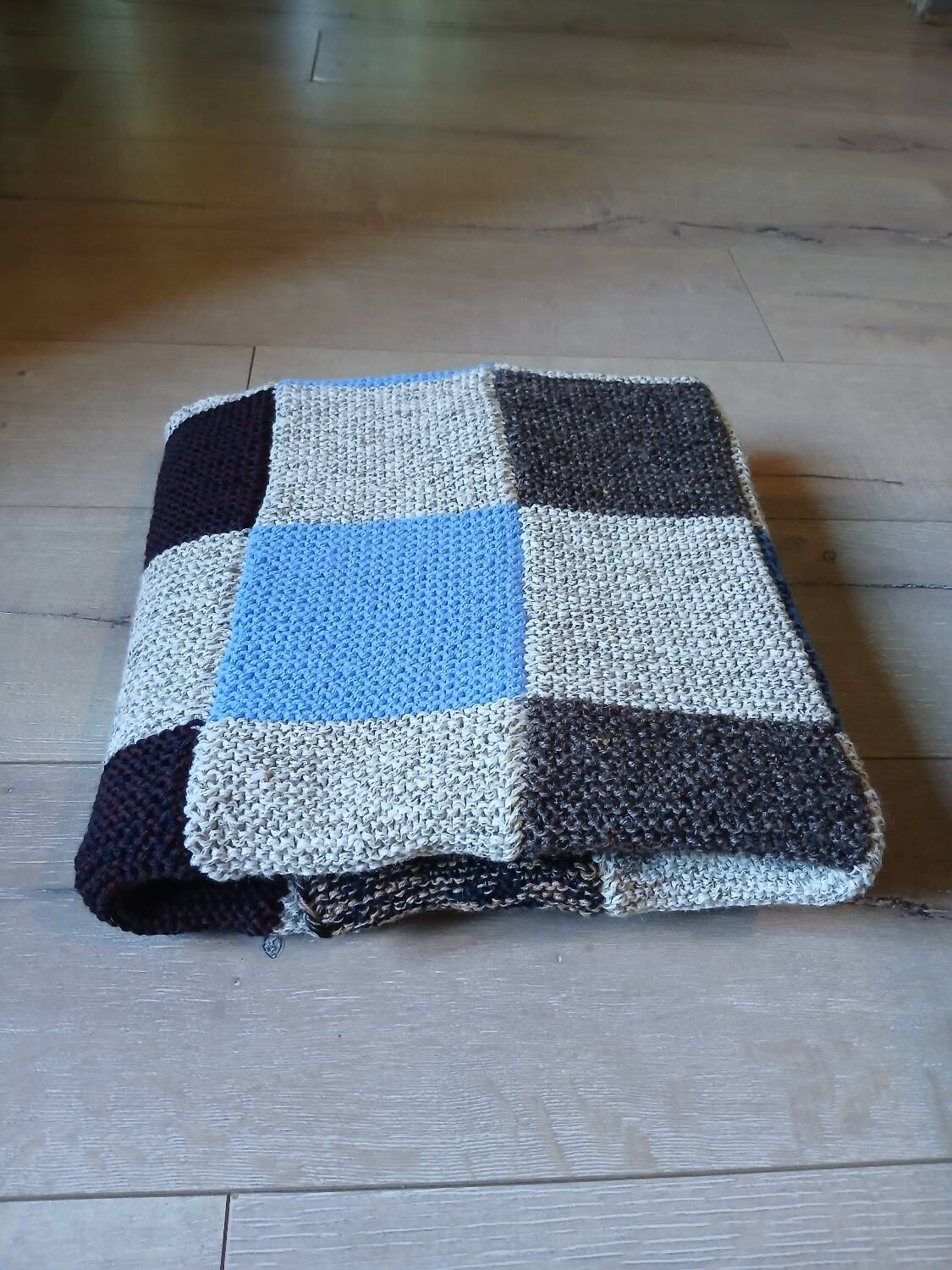 Hand knitted patchwork plaid