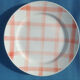 Round/flat serving dish, Moulin des Loups Orchies décor Scottish tiles orange