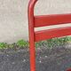 2 red metal Tolix-style chairs, France 1950