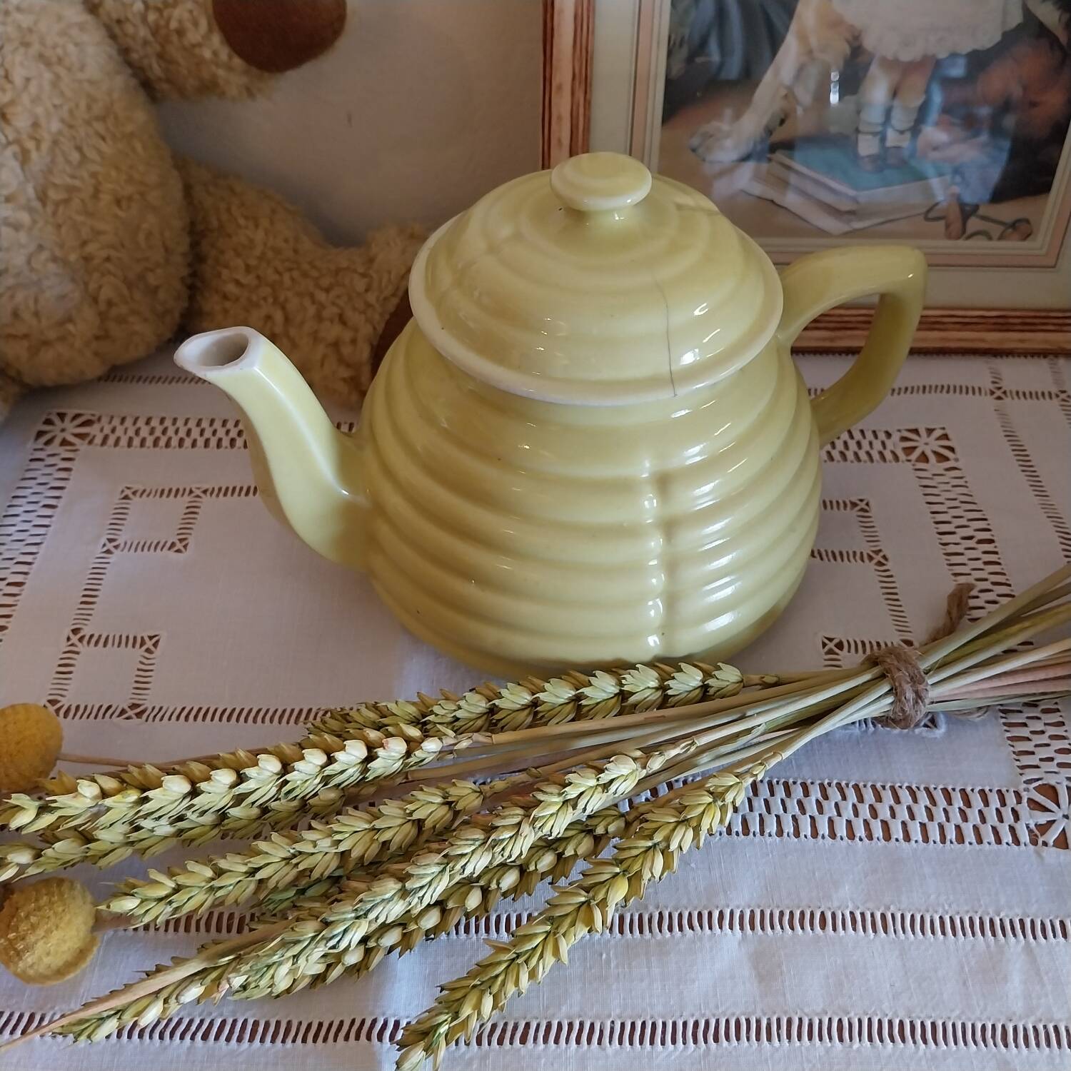Old yellow earthenware teapot
