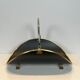 Neoclassical log holder in brass and black lacquered brass